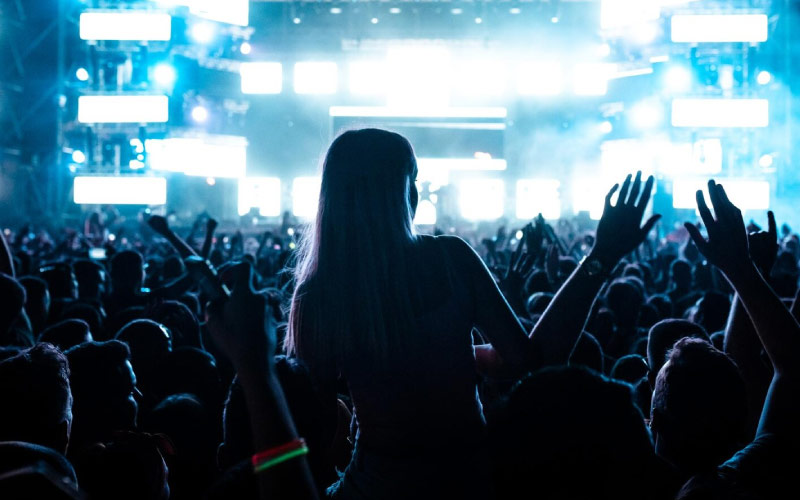 concertgoers screaming at a festival, VIP bus charter, July 2024, UK