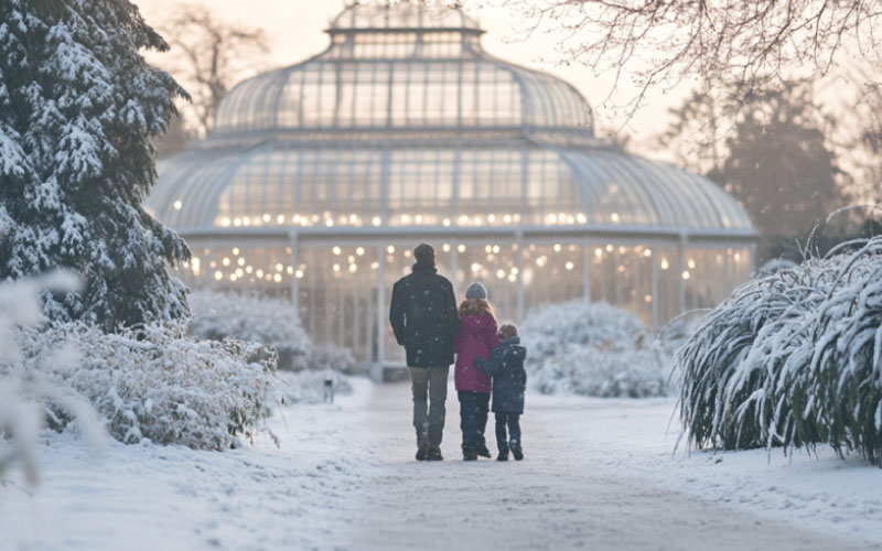 family at wintry snowy Kew Gardens, white winter trip, November 2024, UK