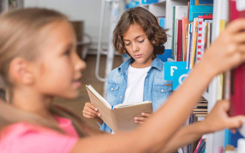 children looking at titles in a bookshop, London literary trip, November 2024, UK