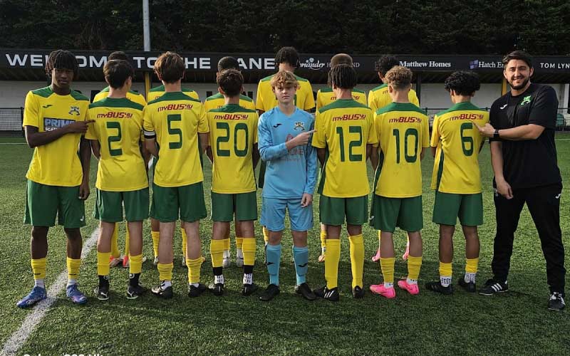 Rayners Lane FC players on the pitch with MyBus4U logo