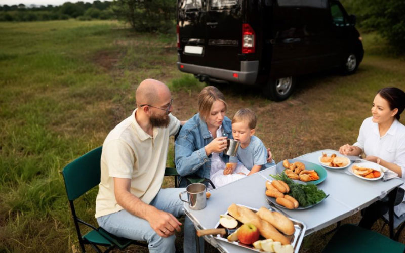 a young family talking in a minibus, family trip, September 2024, UK